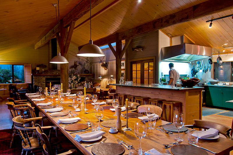 Communal dining table in main lodge building at Poronui
