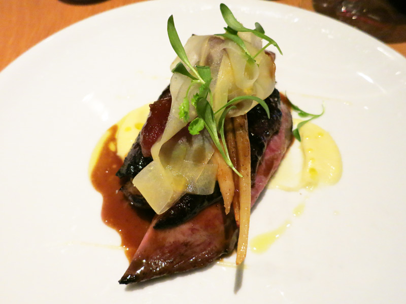 Ash-grilled duck breast with white carrots, salsify ribbons and Medjool dates at <i>The Bridge Room</i> - Photo by Hideaway Report editor