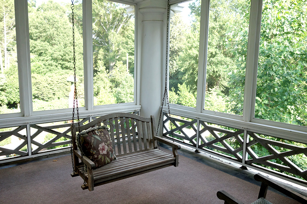 The screened-in porch of our Dowd Suite at The Duke Mansion in Charlotte, North Carolina - Photo by Hideaway Report editor